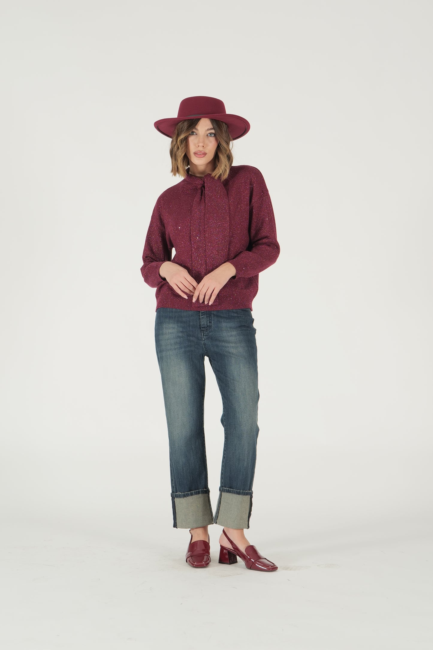 Maglia in lurex con collo a fiocco