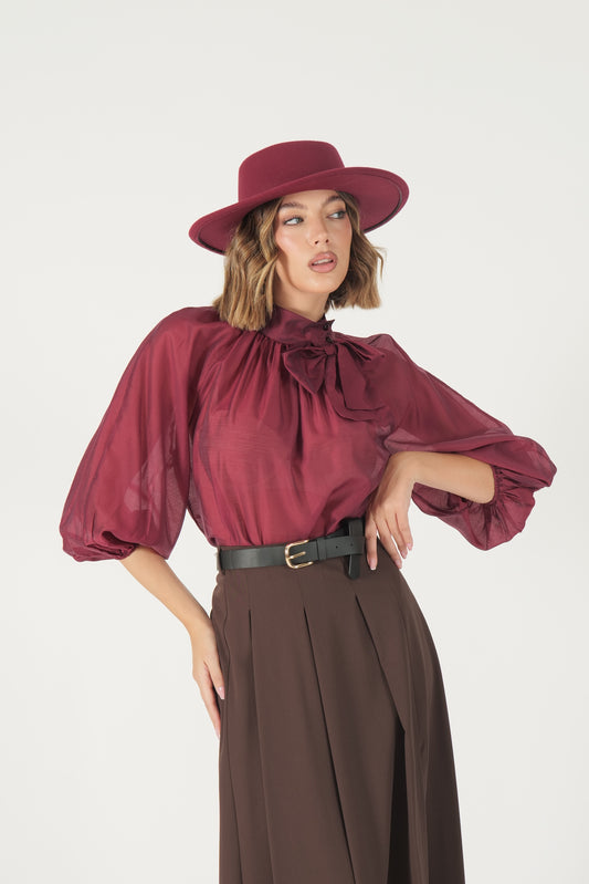Blusa con fiocco e manica a palloncino