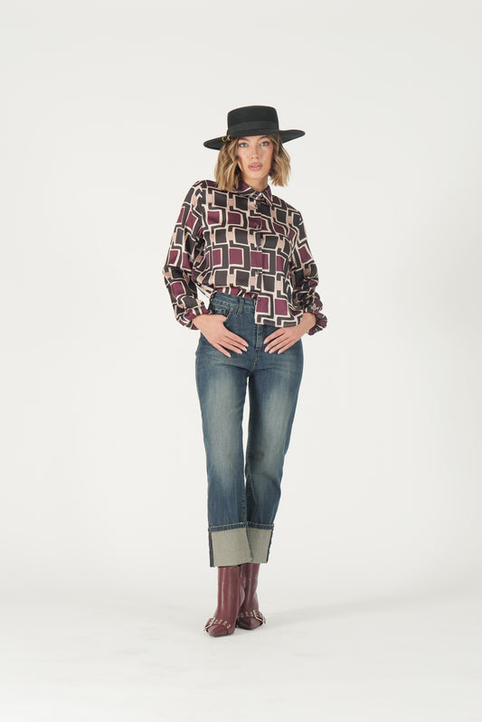 Jeans sabbiato con risvolto