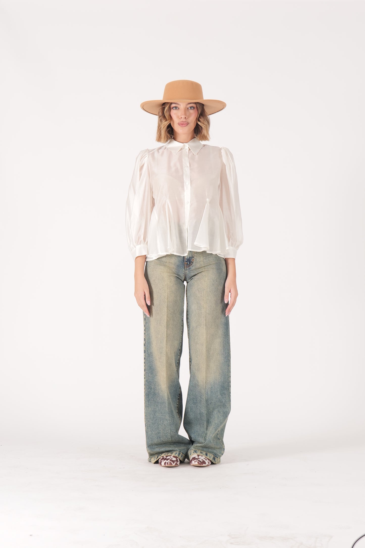 Jeans over sabbiato