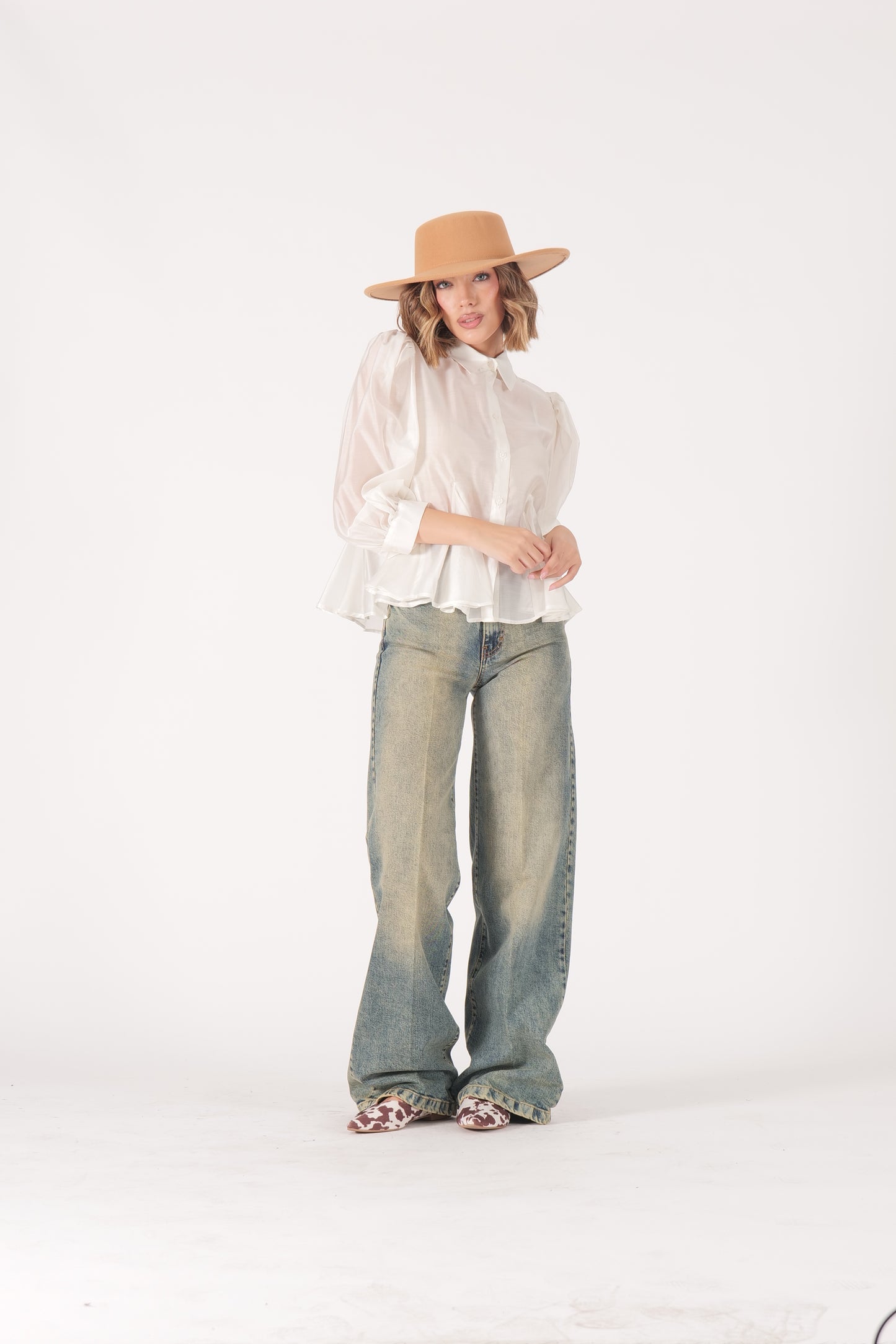 Jeans over sabbiato
