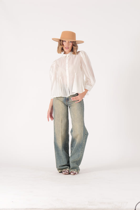 Jeans over sabbiato